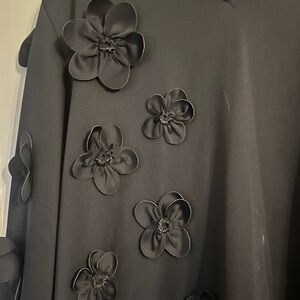 Caryn Law black dress  trapeze style. The flowers make this special.